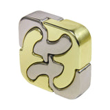 Gold and silver puzzle piece-shaped object on a white background