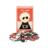 Puzzle box with a cat illustration and 'Andy Pawhol' text, featuring puzzle pieces on a white background.