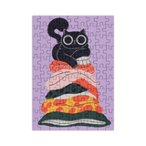 Jigsaw puzzle with a black cat design on a purple background