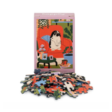 Puzzle set with colorful pieces and a box featuring a rabbit illustration on a white background