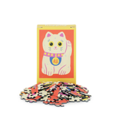 Jigsaw puzzle with a cat design on a red background
