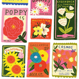 Collection of colorful seed packets with floral designs and text.