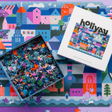 Jigsaw puzzle with colorful houses and a box labeled 'holiyau' on a matching background.