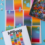 Colorful puzzle with a partially completed design on a blue background, featuring the brand 'holiyay'.