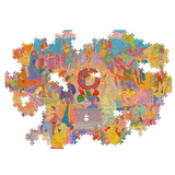 A semi completed jigsaw puzzle featuring a highly detailed, colorful collage of various figures, landscapes, and abstract elements in a vibrant multicolor palette, set against a solid white background.