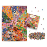 Colorful puzzle with pieces scattered, packaging, and a small portion of the completed puzzle.