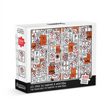 A 500-piece jigsaw puzzle box by Main & Local, titled 'Les Toiles du Parking & Montreal' ('The Pleasures of Parking in Montreal'). The box features a colorful graphic of various parking signs and symbols in orange, red, black, and white, set against a clean white background.