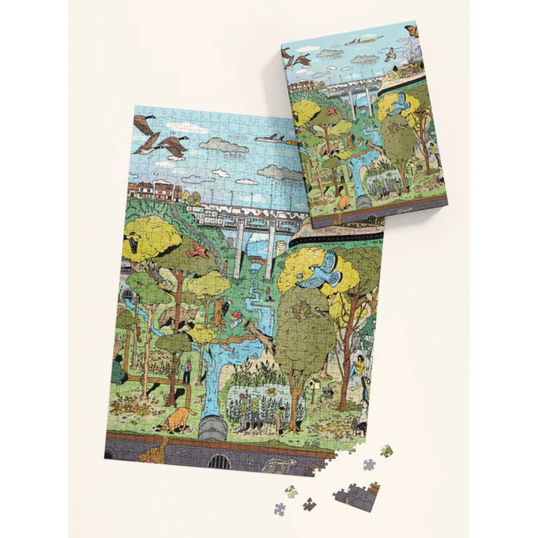 Jigsaw puzzle with a scenic design of trees, animals, and a bridge on a white background.