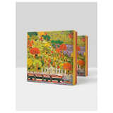 A boxed art puzzle featuring a colorful autumn park scene with trees in red, orange, yellow, and green, a white building, and a red streetcar, shown on a light gray background with two additional boxes behind it.