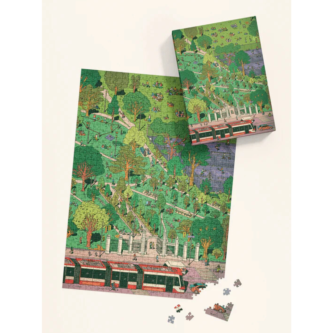 Jigsaw puzzle with a scenic design of a park and tram on a white background