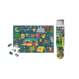 jigsaw puzzle with camper, trees, and animals on a blue background, accompanied by a tube of puzzle pieces.