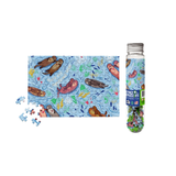 Puzzle in a cylindrical tube with puzzle pieces on a white background