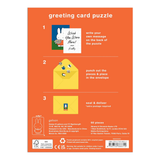 Greeting card puzzle packaging with instructions on an orange background