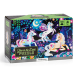A 100-piece children's jigsaw puzzle box by Mudpuppy, titled 'Glow in the Dark PUZZLE'. The packaging features a vibrant, magical illustration of three unicorns in a starry night forest.
