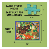 Jigsaw puzzle packaging graphic on a light olive green background, showing a forest-themed puzzle with animals and dimension callouts: 14 by 11 inches, plus a large blue puzzle piece labeled 6.5 by 4 inches.