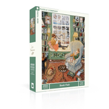 A boxed jigsaw puzzle from New York Puzzle Company titled 'Book Club' by artist Anni Men, showing a vintage illustrated scene of two people reading in a cozy room. The box is white with green side panels and displays 750 pieces.