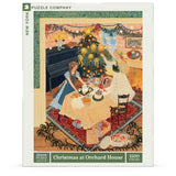 Jigsaw puzzle packaging featuring a Christmas scene with people around a tree.