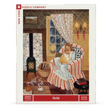Jigsaw puzzle packaging featuring a cozy indoor scene with a woman and a child under a blanket.
