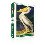 Jigsaw puzzle box featuring a majestic pelican design on a white background