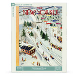 New York Puzzle Company puzzle box with a winter scene illustration of sledding and skiing, featuring 'The New Yorker' logo.