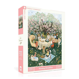 Jigsaw puzzle box with an illustration of a garden scene and people at a table, featuring the New York Puzzle Company branding.