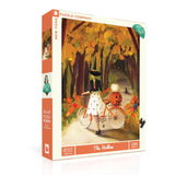 Jigsaw puzzle box with a Halloween-themed illustration of a woman on a bike with a pumpkin.
