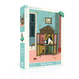 A 750 piece jigsaw puzzle box by New York Puzzle Company titled 'The New Tenant', featuring an illustration of a black and white cat inside a wooden cabinet in a teal room.