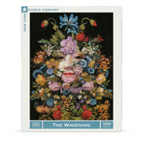 Jigsaw puzzle packaging featuring a floral mask design with 'The Wakening' title and 'New York Puzzle Company' branding.