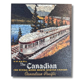 Jigsaw puzzle box featuring a train and scenic route advertisement for Canadian Pacific