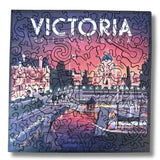 Puzzle box with a cityscape design and 'Victoria' text on a purple and pink gradient background