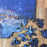 Blue puzzle pieces on a wooden surface