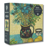 Jigsaw puzzle box with Van Gogh's 'Still Life' design featuring a vase with flowers and fruits.