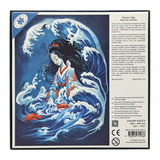 Jigsaw puzzle packaging with a design of a woman in traditional attire surrounded by waves on the back.