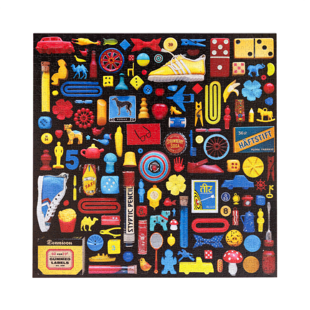 Collection of colorful vintage-style small objects on a black background