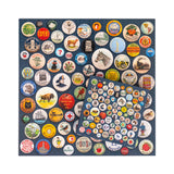 Collection of vintage-style buttons arranged in a pattern on a blue background