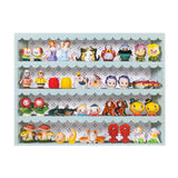 jigsaw puzzle of a shelf with various small  vintage salt and pepper shaker figurines on a light blue shelf 