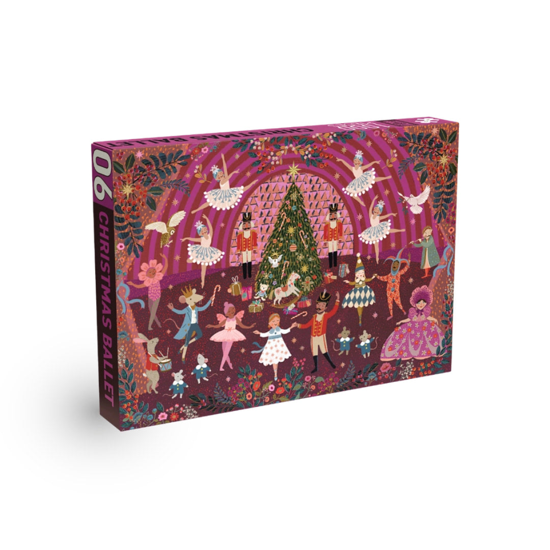 Jigsaw puzzle box with festive design featuring dancers and a Christmas tree on a white background