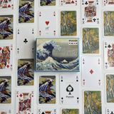Playing cards with artistic designs on a white background