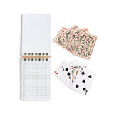 Notebook with grid pages and playing cards on a white background