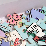 Colorful puzzle pieces with abstract designs on a light gray background