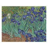 Mosaic artwork of blue flowers with green leaves on a white background