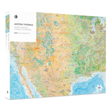 Jigsaw puzzle packaging with a map design on a white background