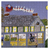 A completed jigsaw puzzle showing a whimsical winter scene with Santa Claus in a red sleigh flying above a gray house with glowing yellow windows and snow-covered roof. The puzzle pieces are clearly visible across the entire artwork.