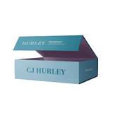 A rectangular jigsaw puzzle box with CJ Hurley written on the box