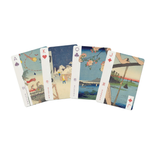 Four illustrated playing cards fanned out on a plain white background. The cards show traditional Japanese-style artwork with suit symbols and card faces partially visible.