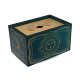 Decorative wooden puzzle box with sun design and wooden top on a white background