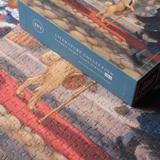 A boxed jigsaw puzzle from the Literature Collection, titled 'Classic Fairy Tale Series 004' shown resting on a completed puzzle featuring a painted scene of a horse and rider with a lion. The box is blue with white text and a circular 'TPT' logo.