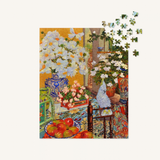 Jigsaw puzzle with a colorful scene of flowers and fruits on a table.