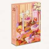 A 500-piece jigsaw puzzle box titled 'The Puzzle Theory' featuring a whimsical retro illustration of a party with candles, cocktails, flowers, and small figures in pastel colors.