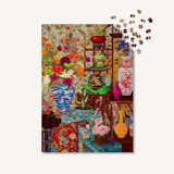 Colorful collage of vases and flowers with a partially completed puzzle on a white background